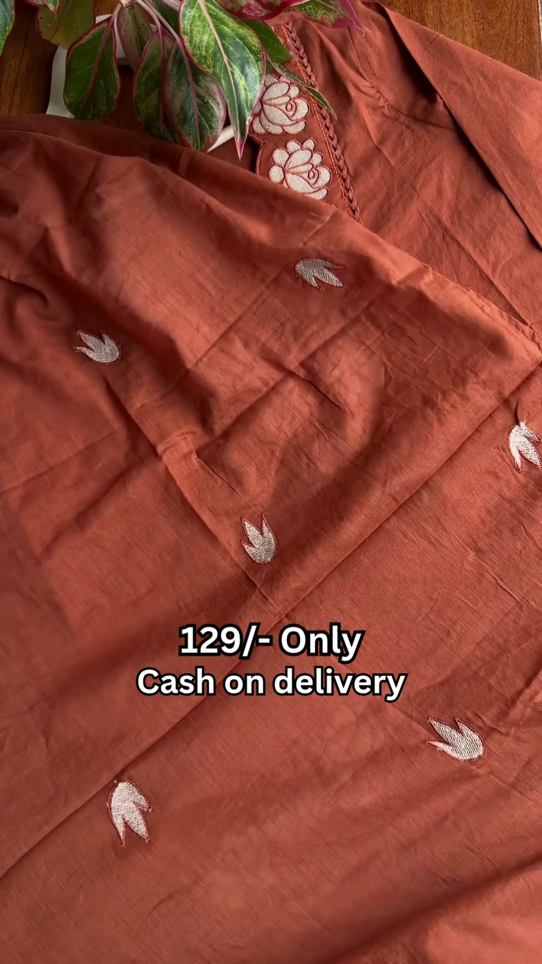 Stylish Rust Orange Kurti with Traditional Embroidery and Tassel Detail